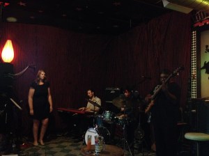 Sarah watches as the band plays.